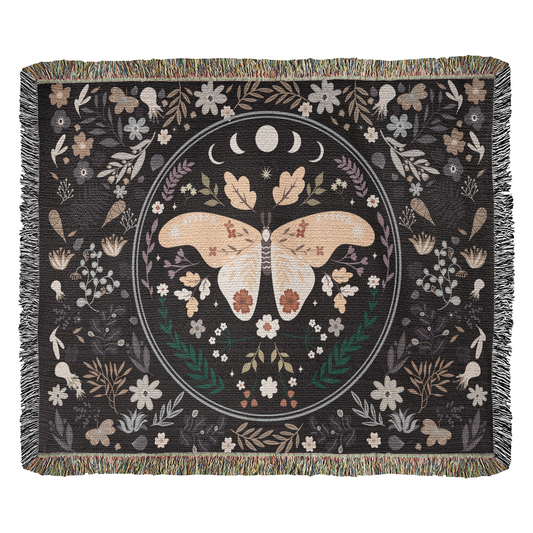 Butterfly heirloom woven blanket draped across a cozy armchair - GLiMOT