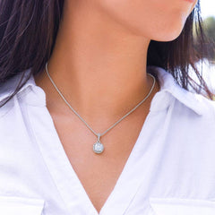 Model wearing the white gold solitaire necklace with a white shirt, showcasing the 18-inch fit and elegant size.