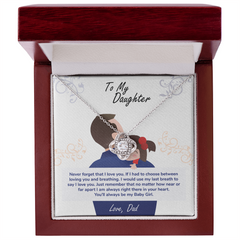 Close-up of cubic zirconia love knot pendant in 14K white gold finish - GLiMOT.COM